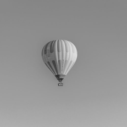 hot air balloon in air showing market forces and inflation