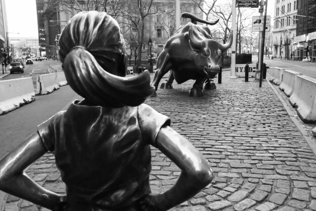 bull statue on wall street, black and white photo